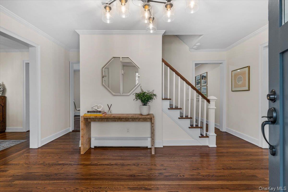 8 Heritage Court Cold Spring Harbor, NY 11724 - Photo 4 of 38 a view of entryway and hall with wooden floor
