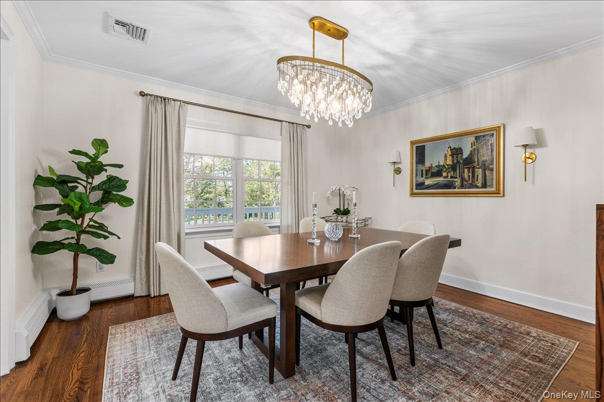 8 Heritage Court Cold Spring Harbor, NY 11724 - Photo 6 of 38 a view of a dining room with furniture window and wooden floor
