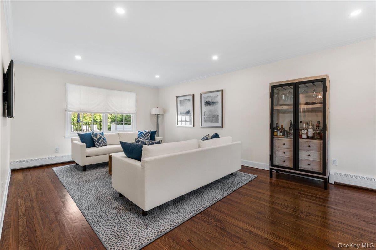 8 Heritage Court Cold Spring Harbor, NY 11724 - Photo 7 of 38 a living room with furniture and wooden floor