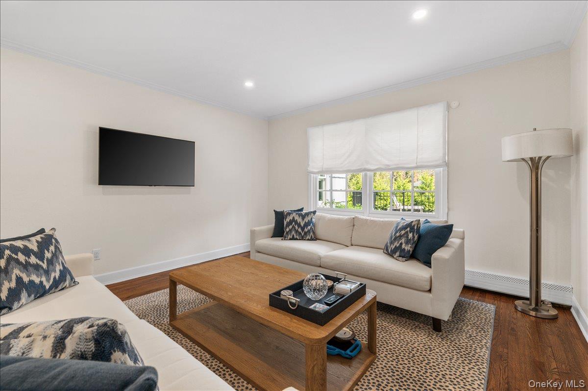 8 Heritage Court Cold Spring Harbor, NY 11724 - Photo 8 of 38 a living room with furniture and a flat screen tv