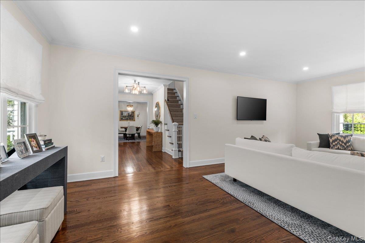 8 Heritage Court Cold Spring Harbor, NY 11724 - Photo 10 of 38 a room with furniture and a flat screen tv