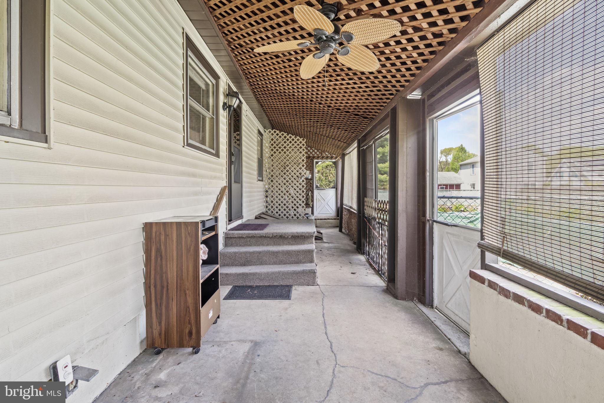 3803 Bethel Road Marcus Hook, PA 19061 - Photo 27 of 34 Enclosed Porch leading to pool and backyard