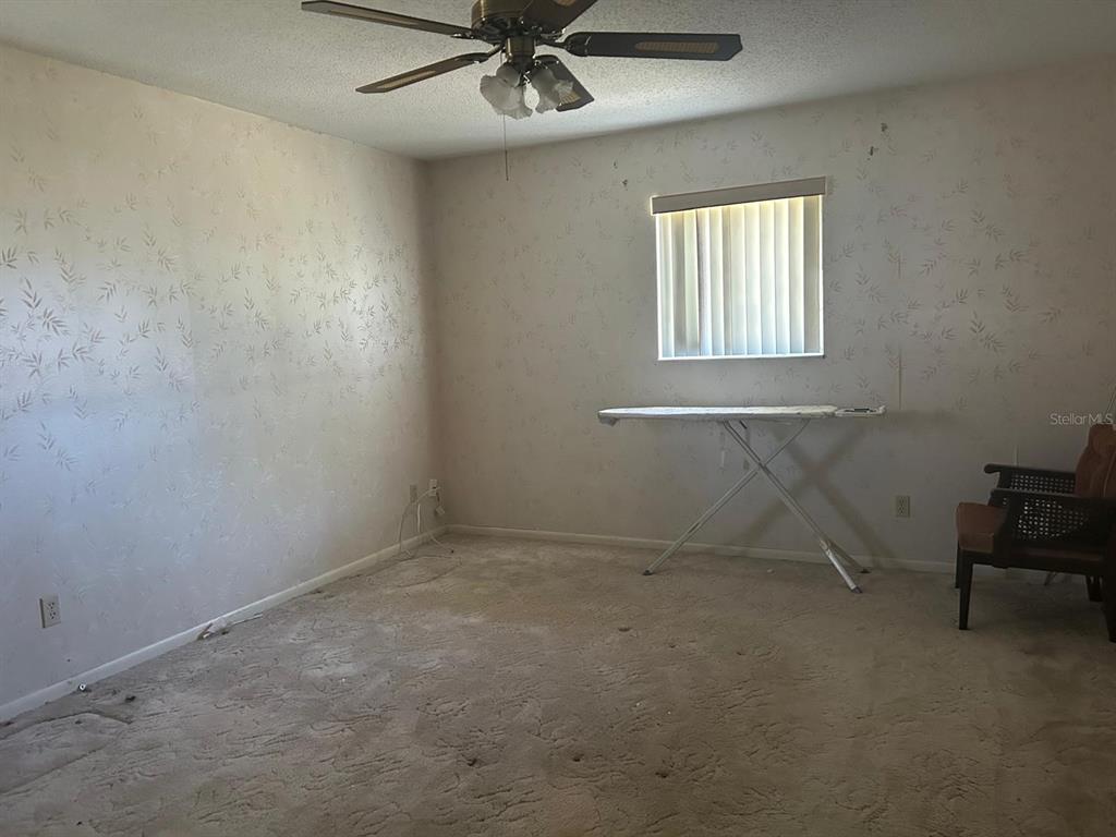 568 Silver Course Loop Ocala, FL 34472 - Photo 17 of 26 a view of an empty room with a window