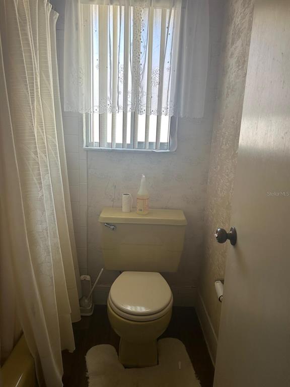 568 Silver Course Loop Ocala, FL 34472 - Photo 18 of 26 a bathroom with a toilet and a shower
