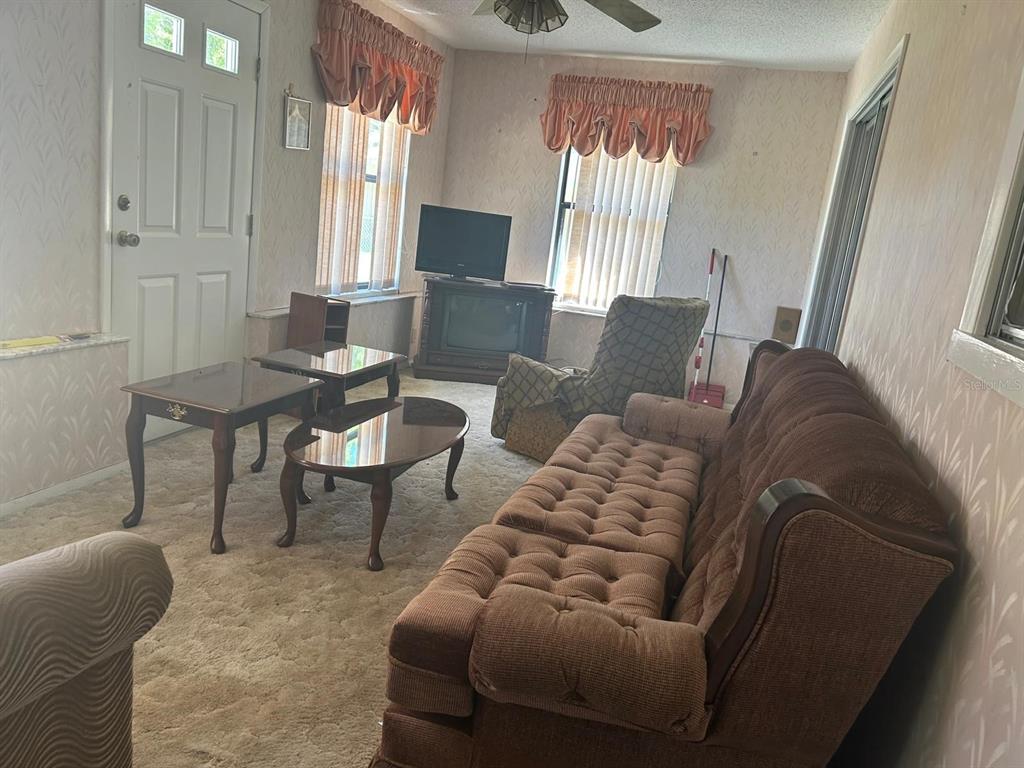 568 Silver Course Loop Ocala, FL 34472 - Photo 9 of 26 a living room with furniture and a window