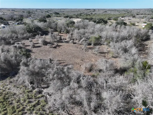 a view of a dry field covered with fog