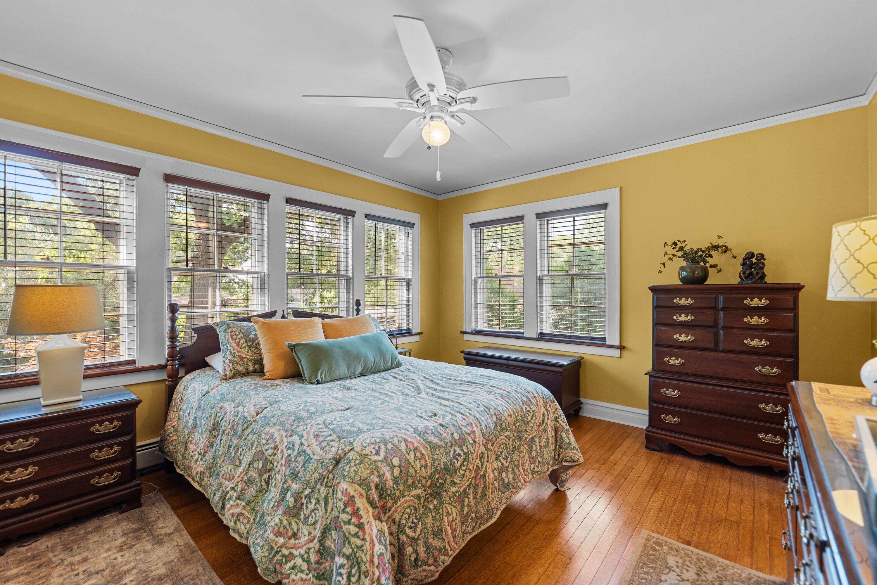 1908 Ridge Road Munster, IN 46321 - Photo 18 of 39 a spacious bedroom with a bed and wooden floor