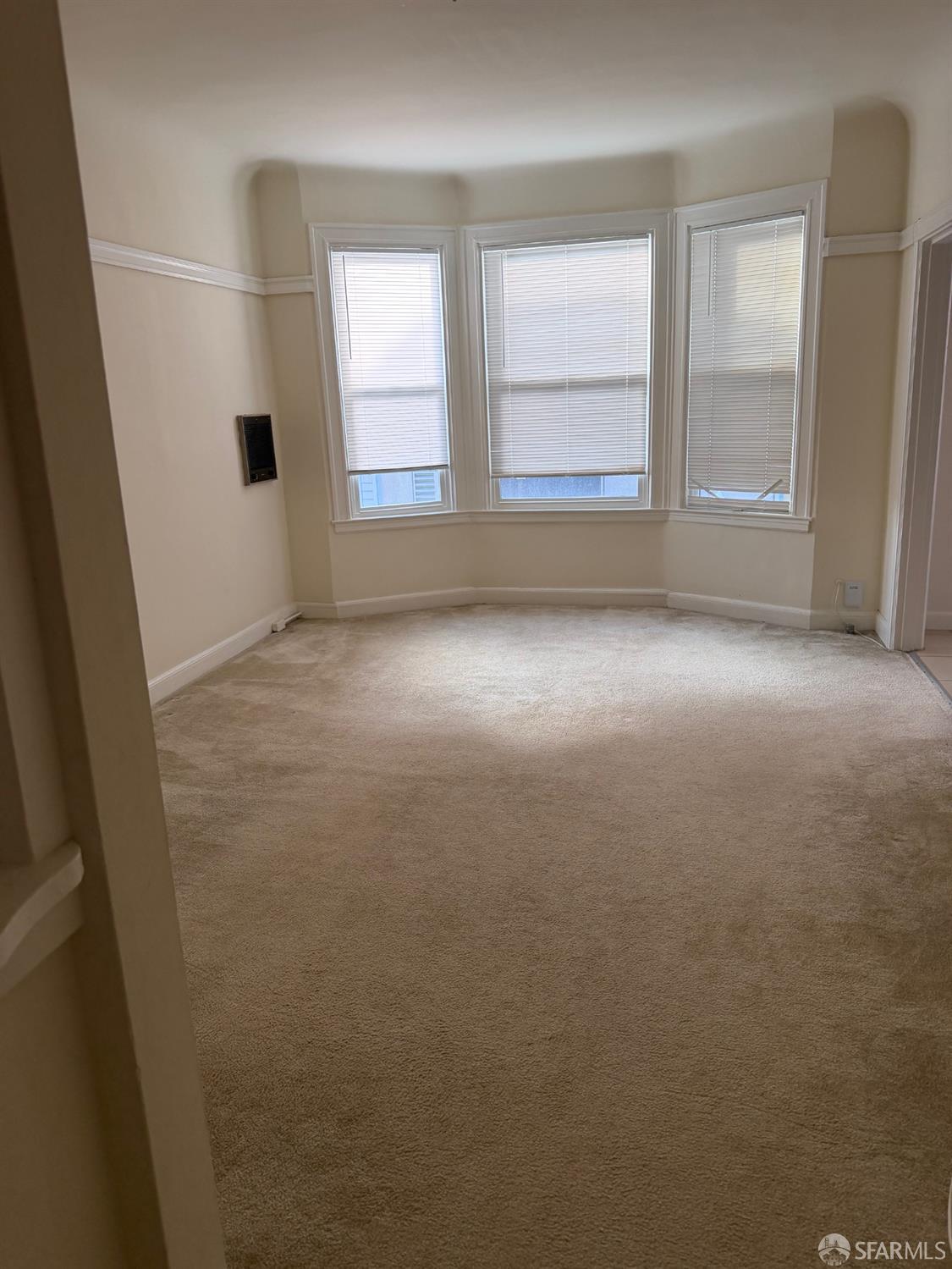 2345 Post Street, Unit 38 San Francisco, CA 94115 - Photo 1 of 5 an empty room with windows and closet