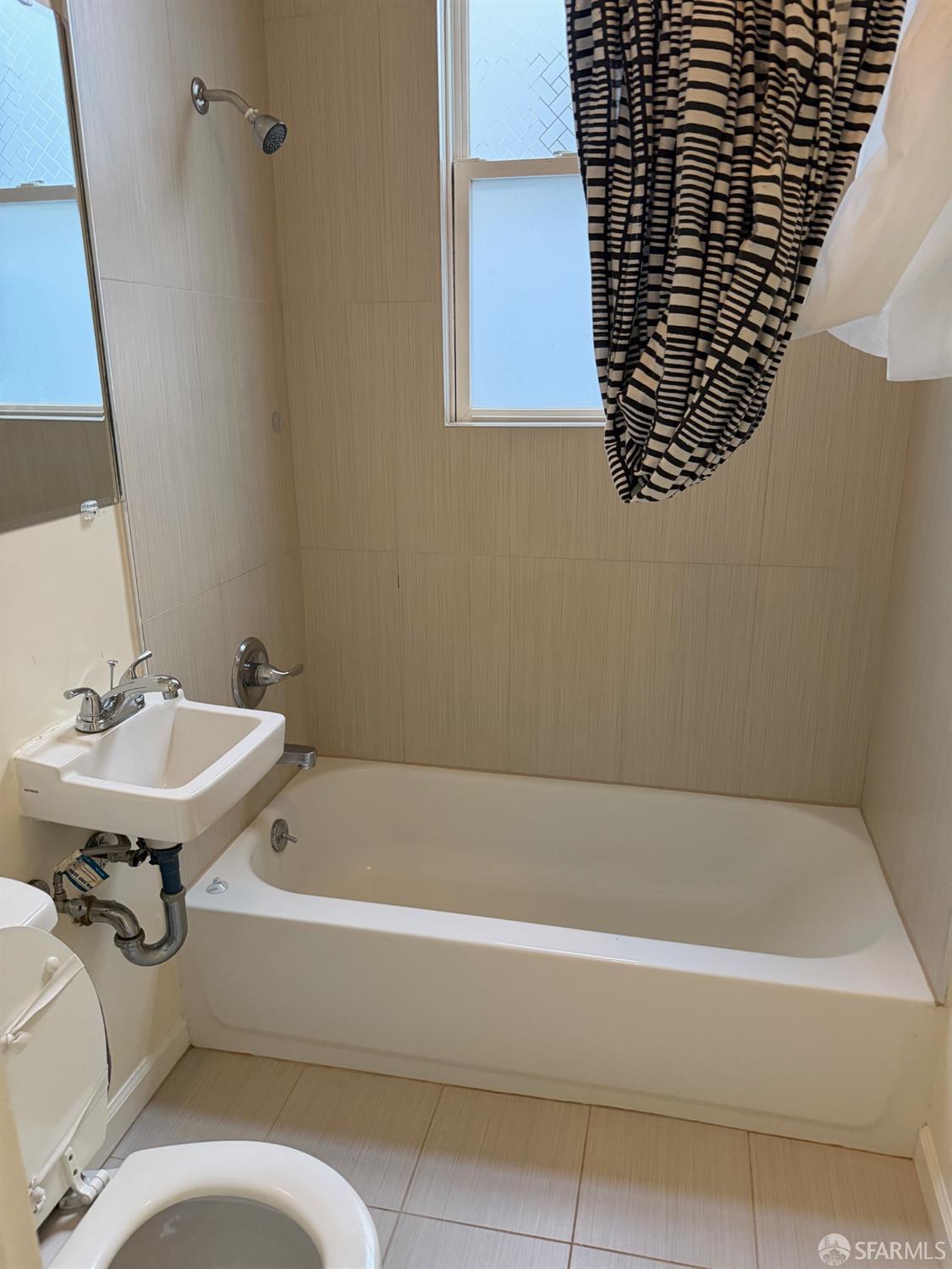 2345 Post Street, Unit 38 San Francisco, CA 94115 - Photo 3 of 5 a bathroom with a bathtub and a sink