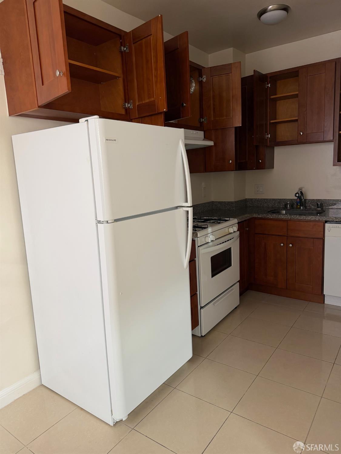 2345 Post Street, Unit 38 San Francisco, CA 94115 - Photo 5 of 5 a white refrigerator freezer sitting in a kitchen