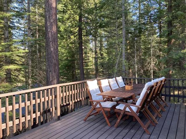 a view of a chairs and table on the deck