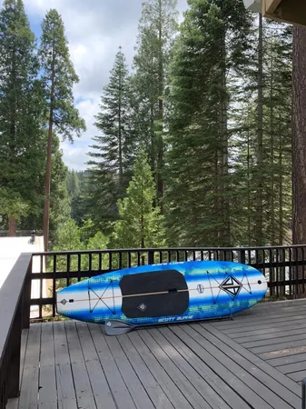 a view of a balcony with wooden floor and bench