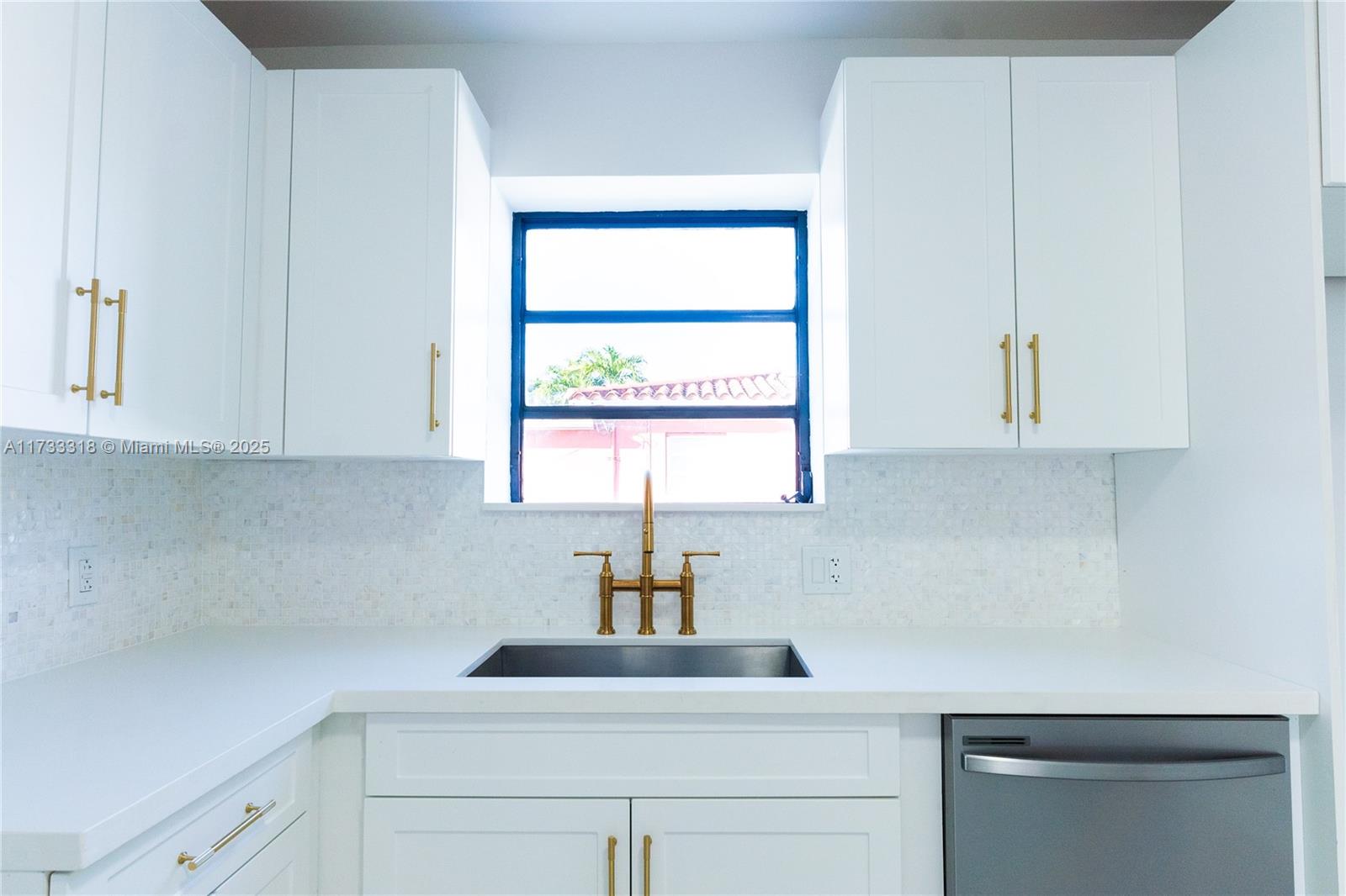 Westchester Miami, FL 33155 - Photo 1 of 17 a kitchen with a sink cabinets and window