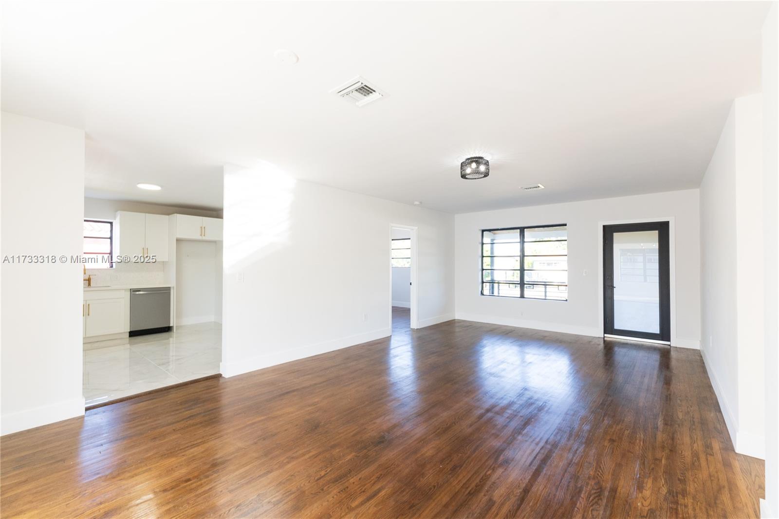 Westchester Miami, FL 33155 - Photo 3 of 17 a view of empty room with wooden floor and windows