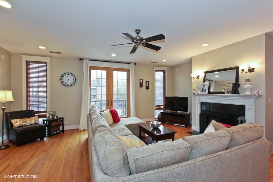 1939 West Division Street, Unit R2 Chicago, IL 60622 - Photo 2 of 9 a living room with furniture fireplace and a flat screen tv