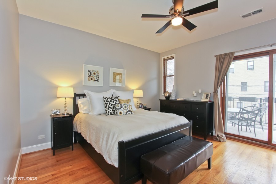 1939 West Division Street, Unit R2 Chicago, IL 60622 - Photo 5 of 9 a bedroom with a large bed and a window