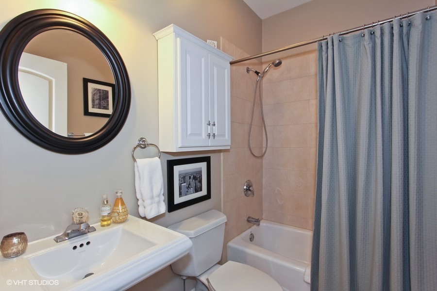 1939 West Division Street, Unit R2 Chicago, IL 60622 - Photo 9 of 9 a bathroom with a sink a toilet and a mirror
