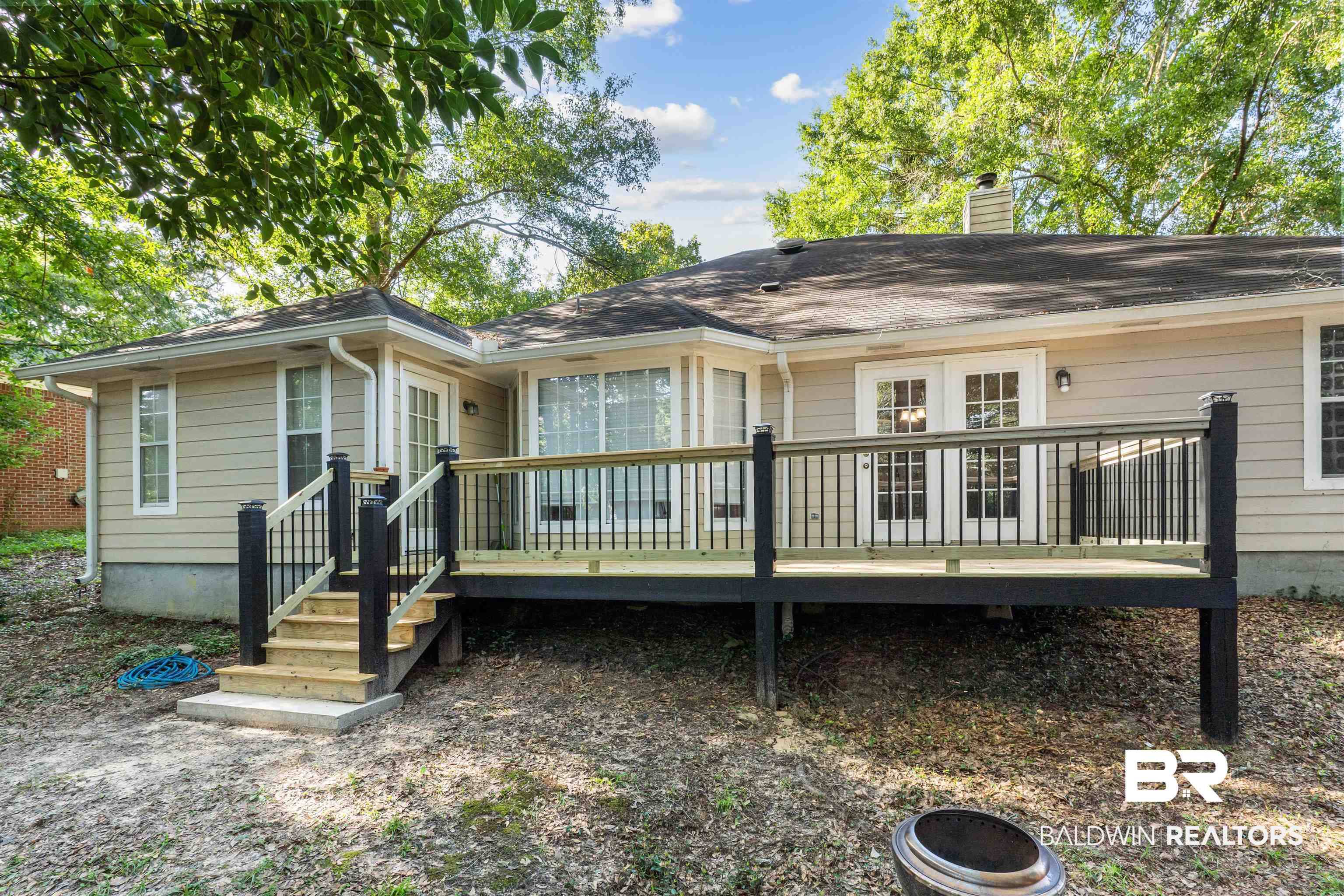 153 Lakeview Loop Daphne, AL 36526 - Photo 46 of 56 The newly resurfaced deck creates a wonderful extension of the living space, perfect for relaxing or entertaining outdoors.