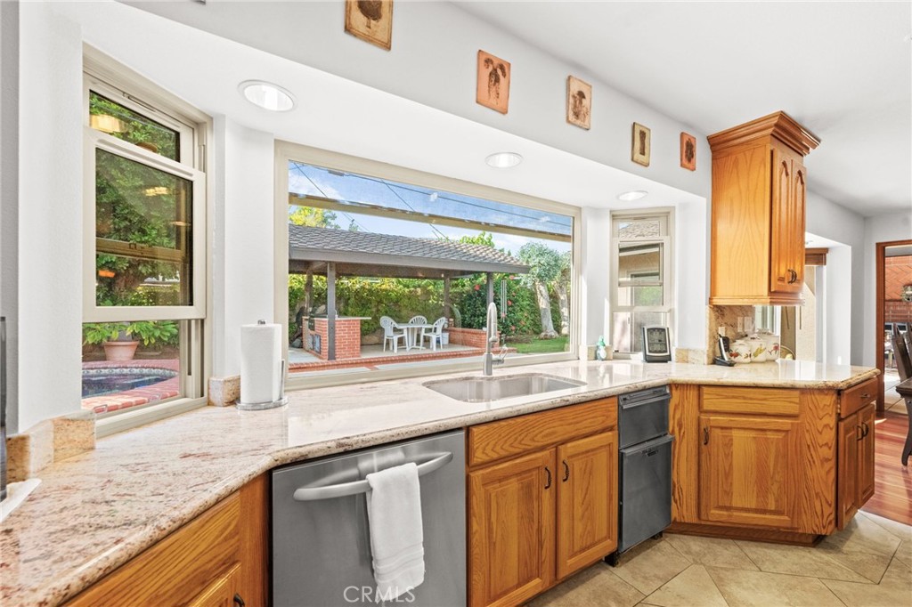 12911 Dean Street Santa Ana, CA 92705 - Photo 16 of 45 a kitchen with a sink and large window