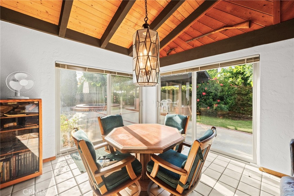 12911 Dean Street Santa Ana, CA 92705 - Photo 23 of 45 a view of a dining room with furniture wooden floor and fan