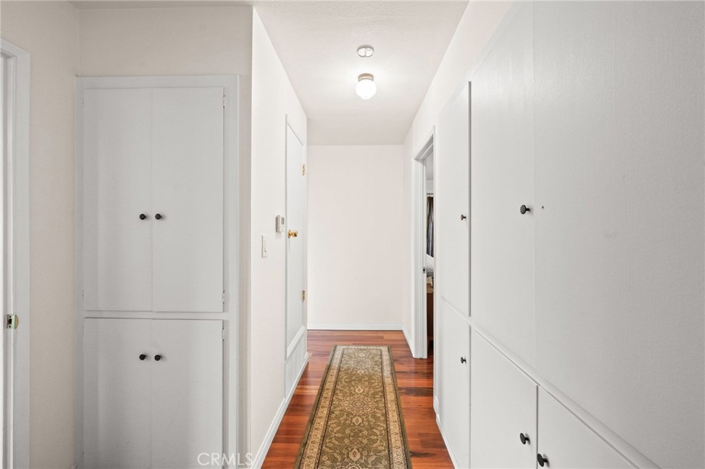 12911 Dean Street Santa Ana, CA 92705 - Photo 29 of 45 a view of hallway with wooden floor