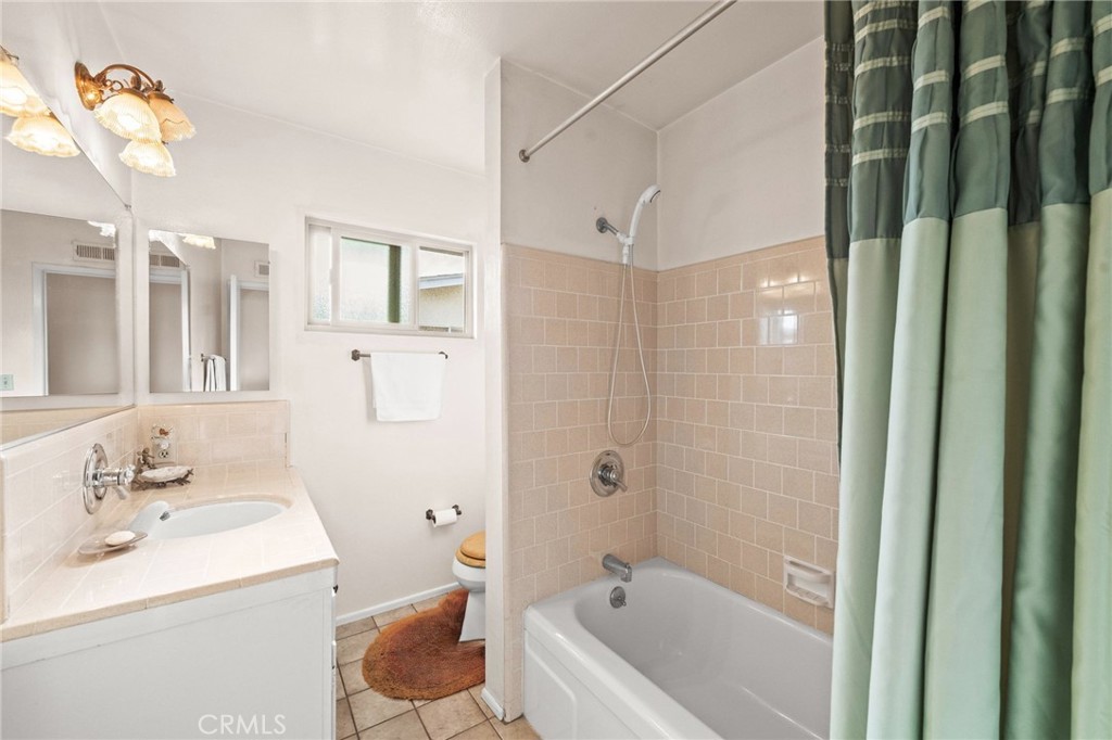 12911 Dean Street Santa Ana, CA 92705 - Photo 31 of 45 a bathroom with a sink toilet and shower