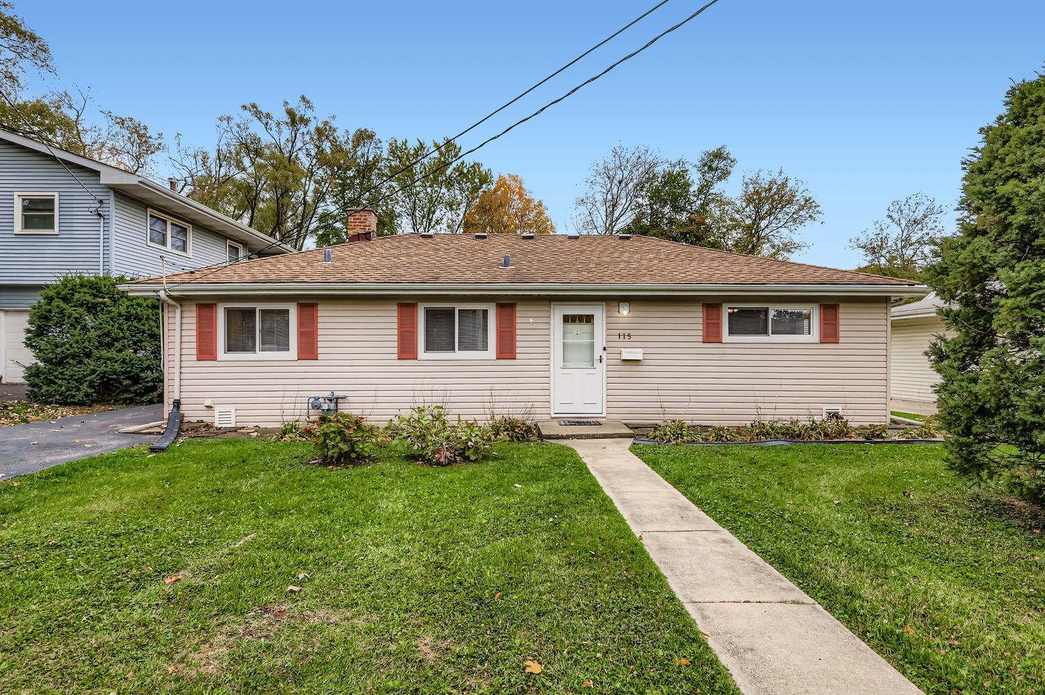 115 West Helen Road Palatine, IL 60067 - Photo 1 of 19 a front view of a house with a garden