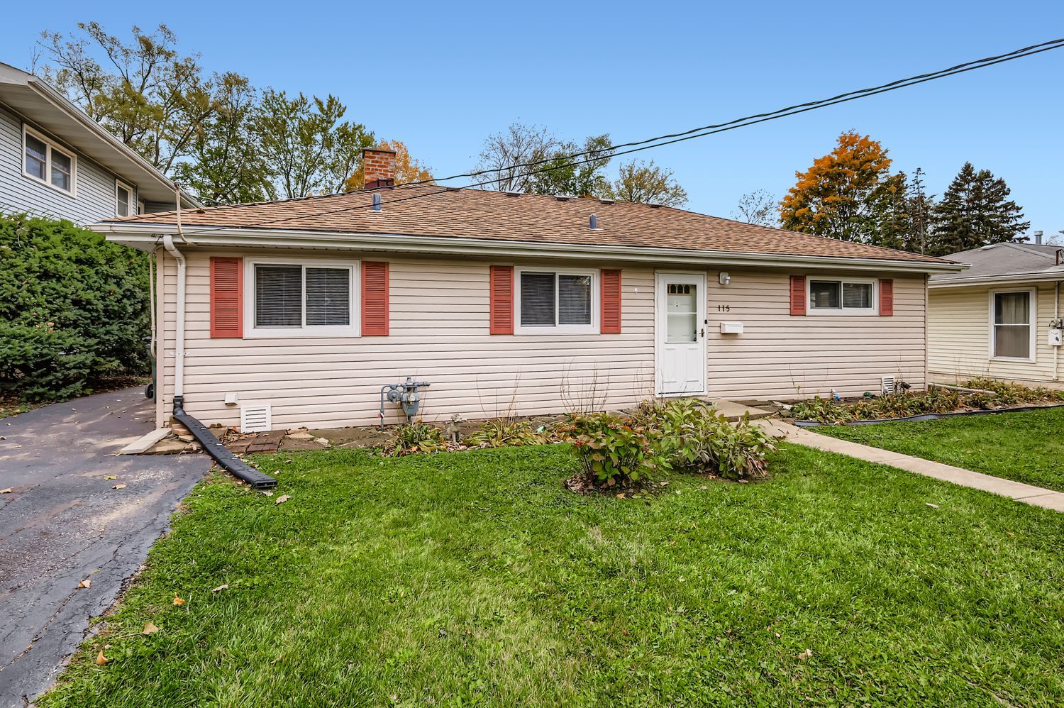 115 West Helen Road Palatine, IL 60067 - Photo 2 of 19 a front view of a house with a yard