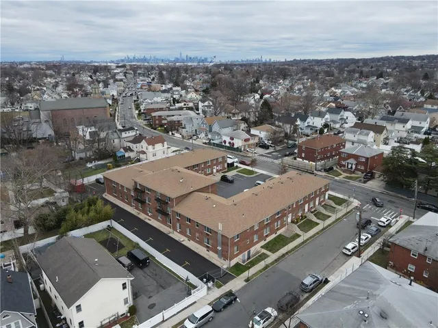 an aerial view of a house with a city view