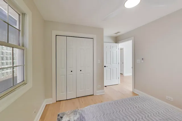 a view of hallway with wooden floor