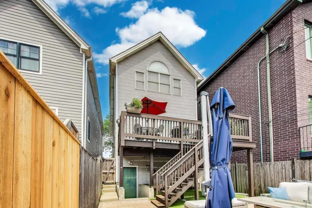 a view of a patio with a table and chairs