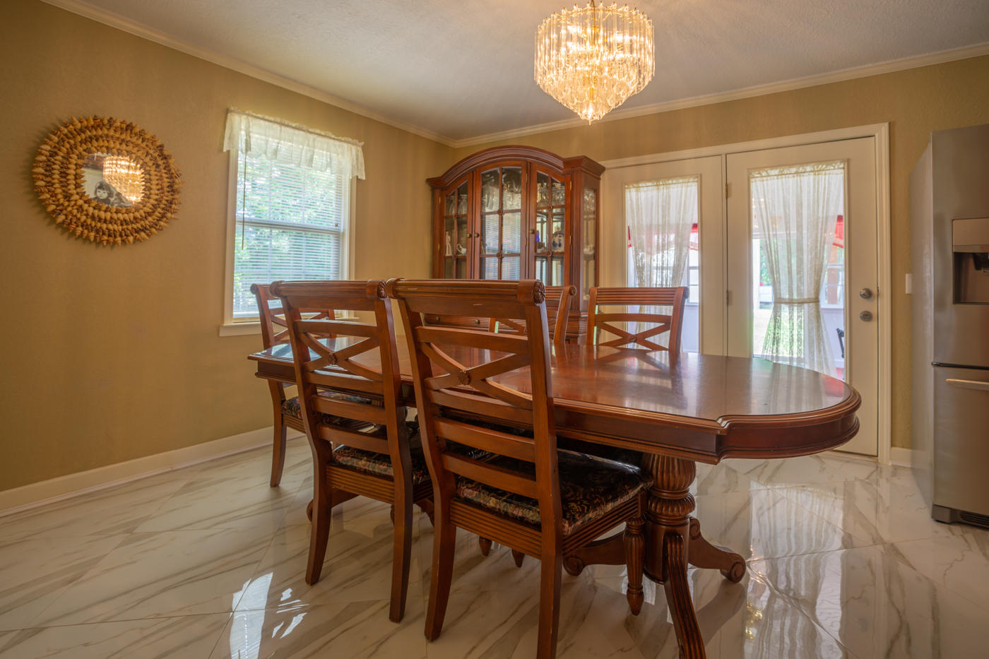 5621 Buckward Road Baker, FL 32531 - Photo 13 of 41 a view of a dining room with furniture and chandelier