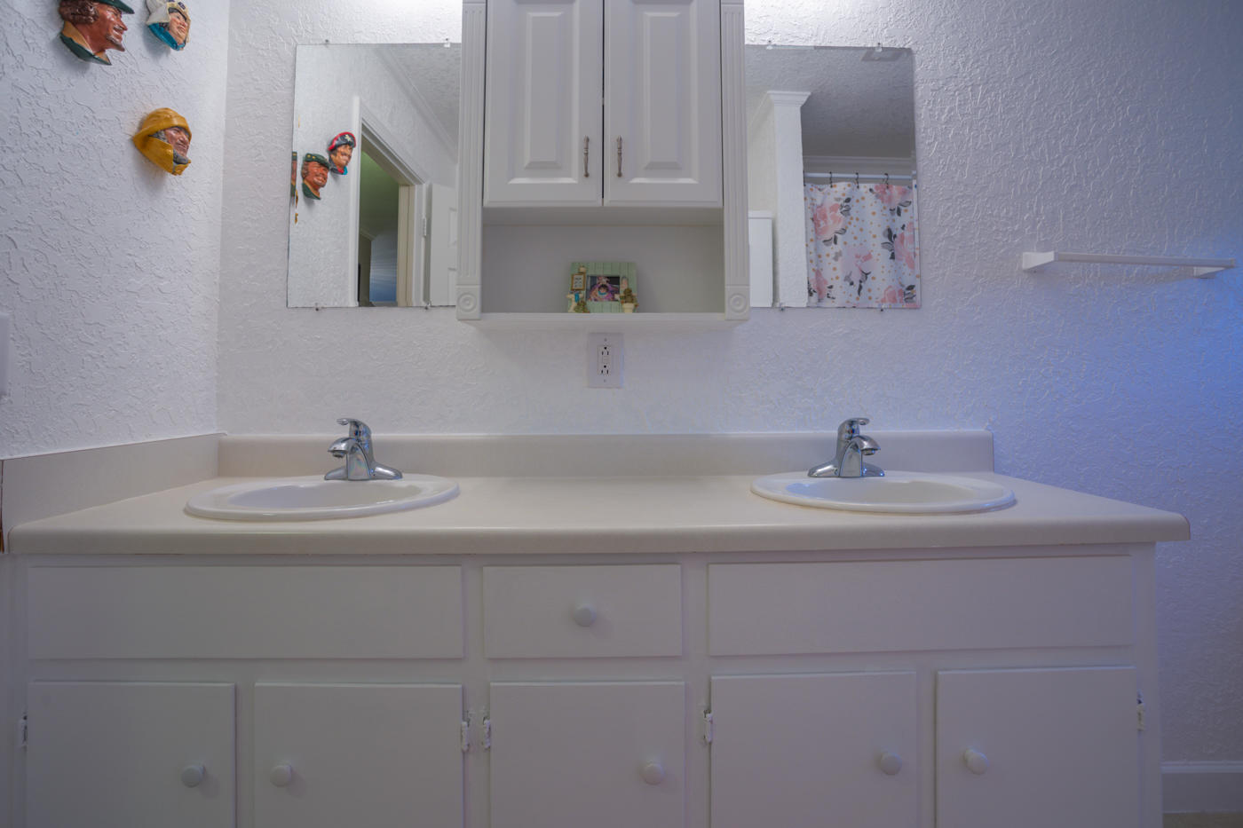 5621 Buckward Road Baker, FL 32531 - Photo 22 of 41 a bathroom with a sink and a mirror