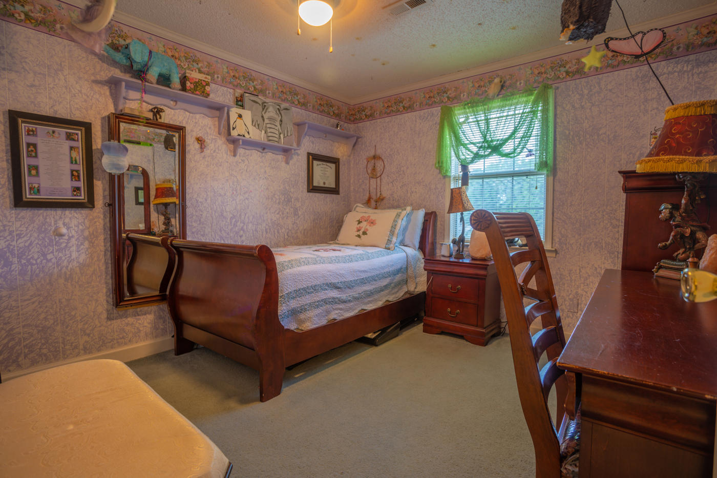 5621 Buckward Road Baker, FL 32531 - Photo 23 of 41 a bedroom with a bed and a desk