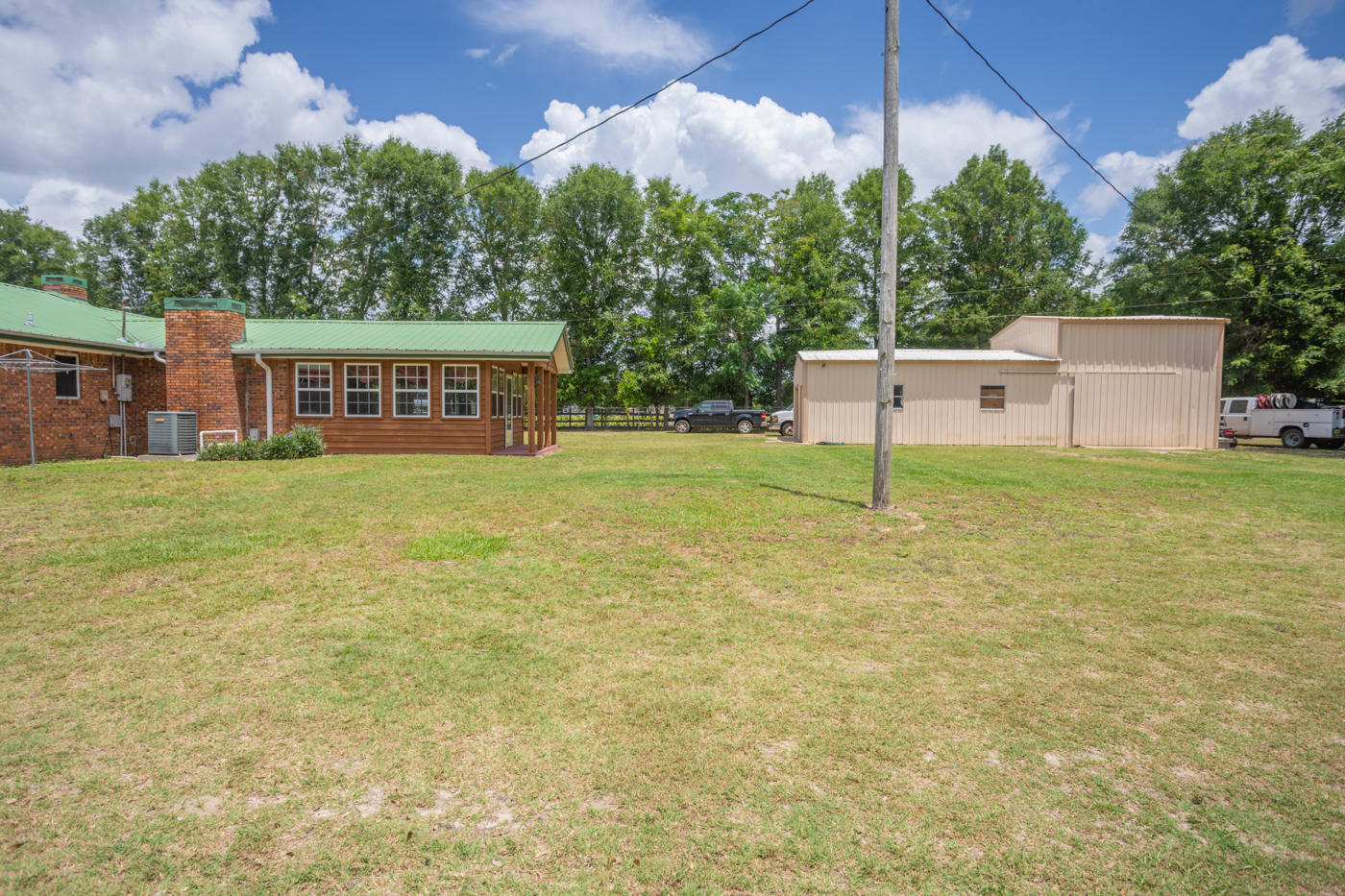 5621 Buckward Road Baker, FL 32531 - Photo 33 of 41 a view of a house with backyard and a yard