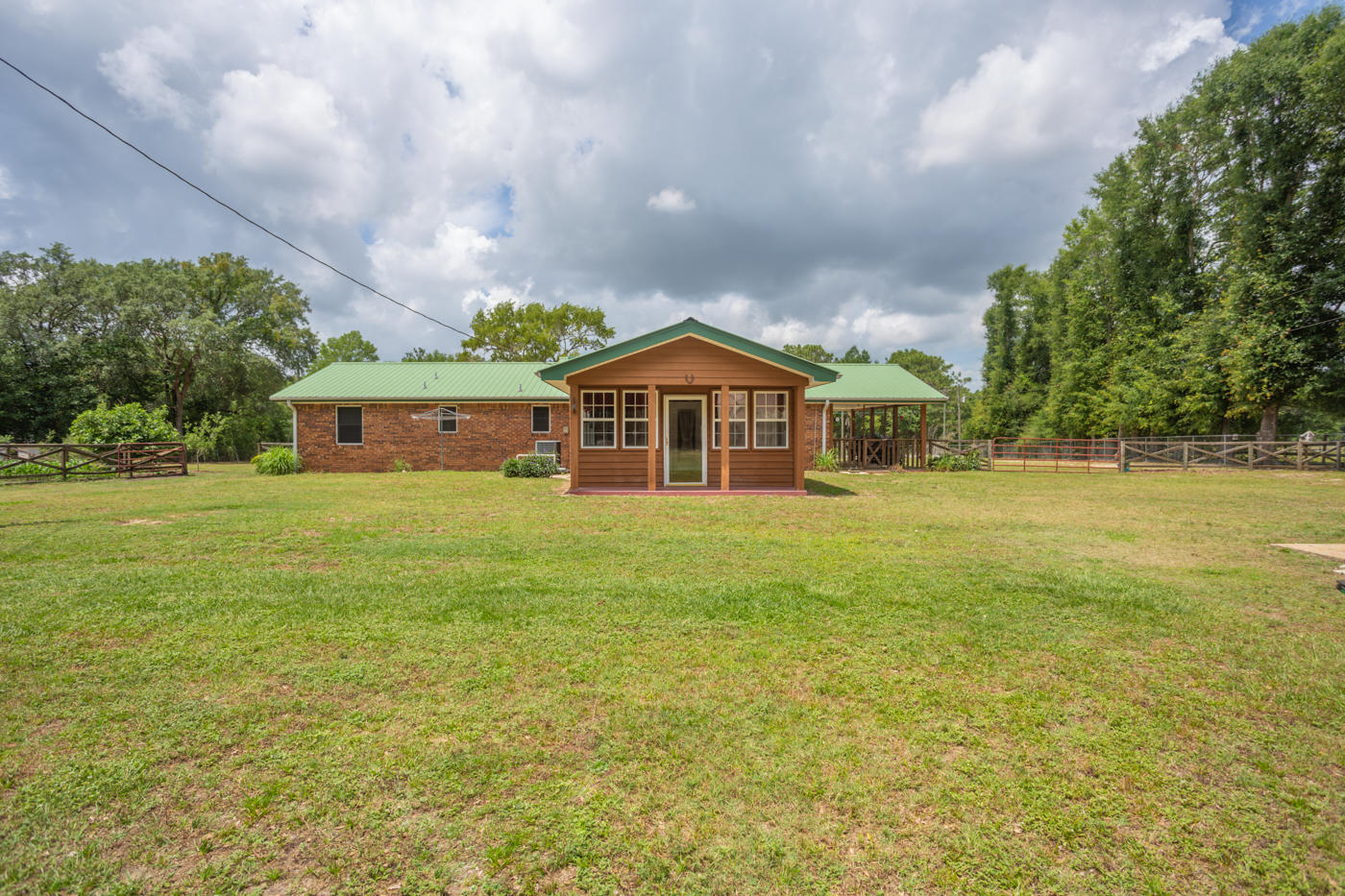 5621 Buckward Road Baker, FL 32531 - Photo 37 of 41 a house view with swimming pool in front of it