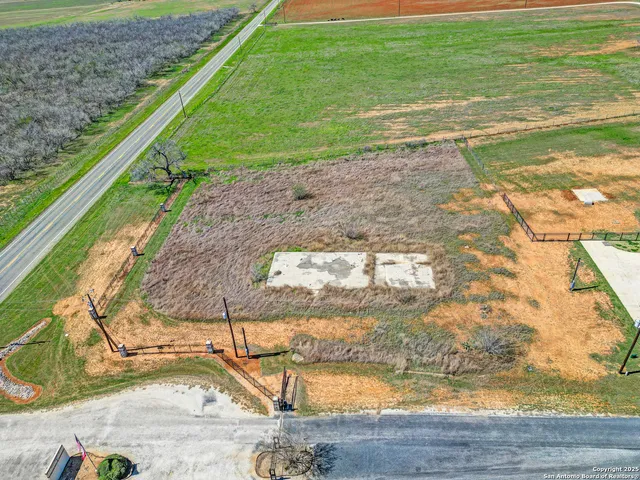 a view of a swimming pool with a yard