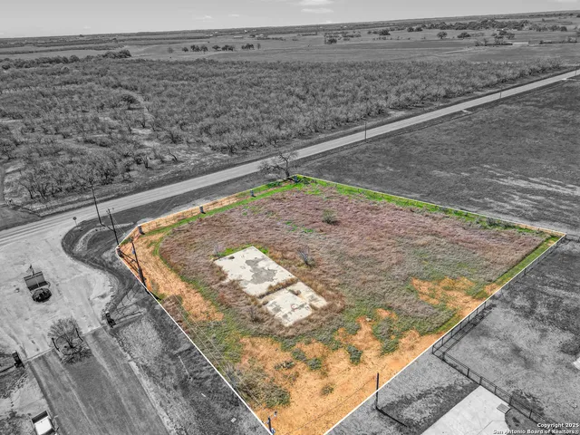 a view of a field with an ocean beach