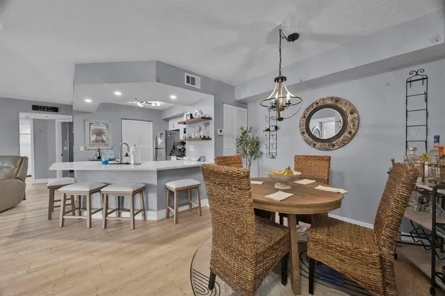 a living room with lots of furniture and a clock
