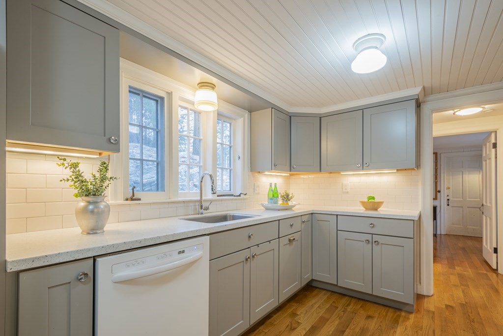 1 Constitution Road Lexington, MA 02421 - Photo 12 of 42 a kitchen with a sink cabinets and wooden floor