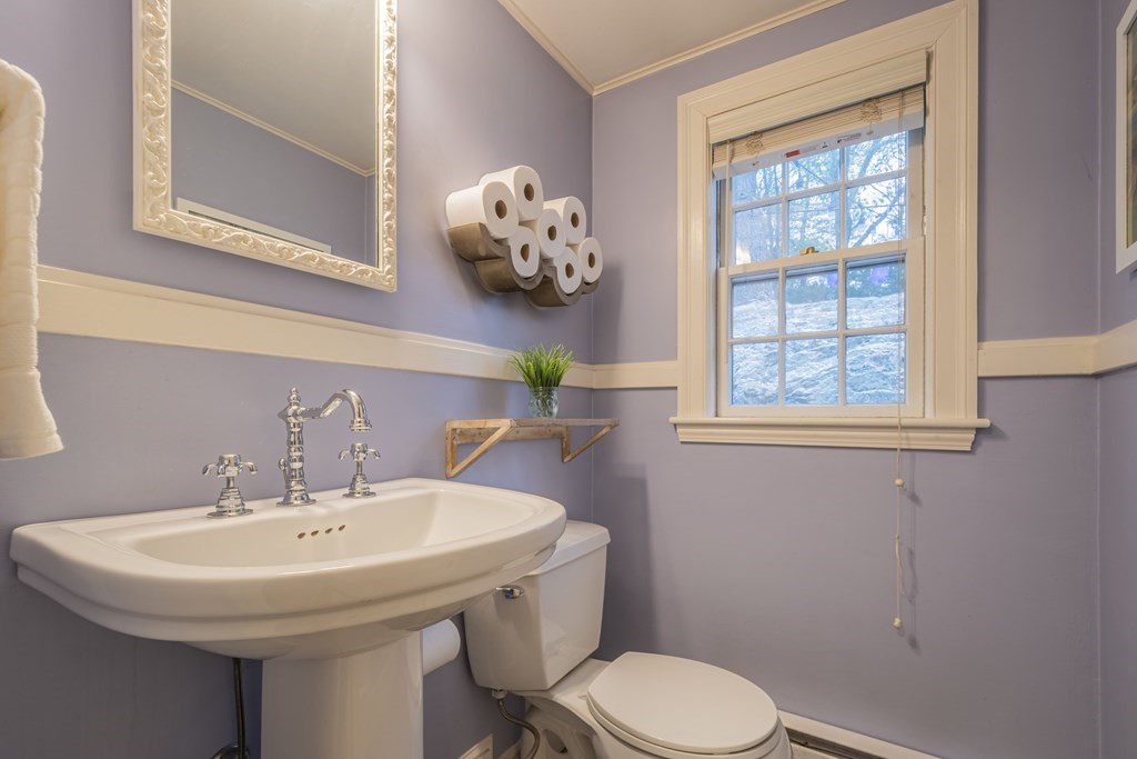 1 Constitution Road Lexington, MA 02421 - Photo 17 of 42 a bathroom with a sink a toilet and a window