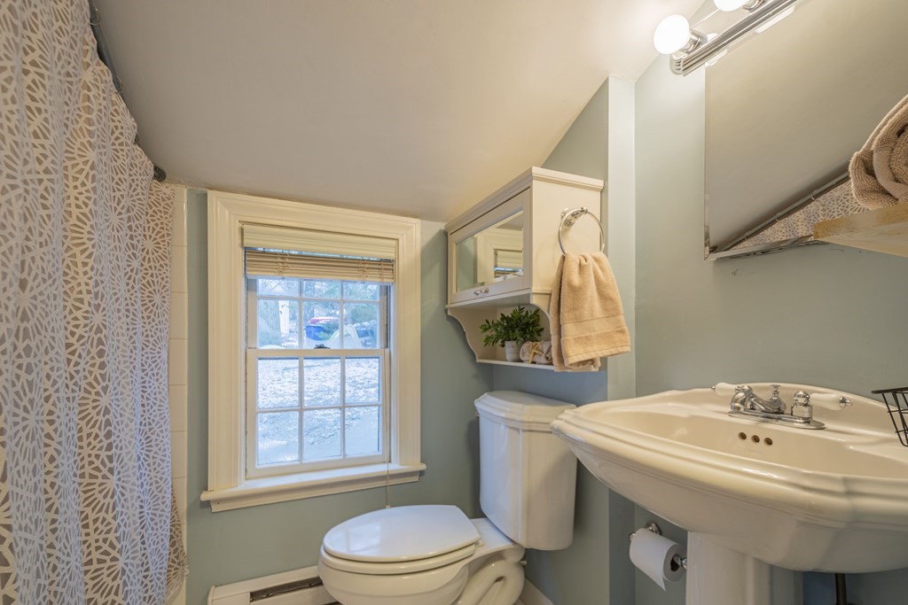 1 Constitution Road Lexington, MA 02421 - Photo 30 of 42 a bathroom with a sink toilet and mirror