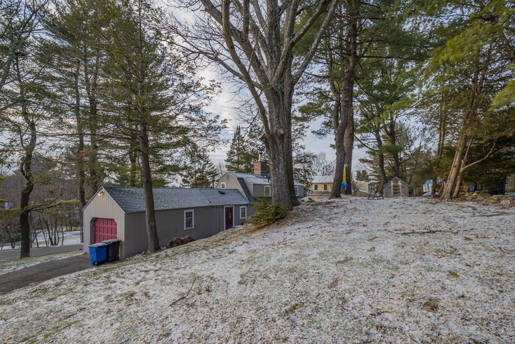1 Constitution Road Lexington, MA 02421 - Photo 41 of 42 a view of a house with a yard covered in snow