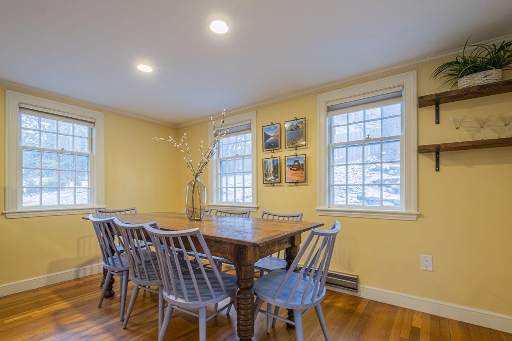 1 Constitution Road Lexington, MA 02421 - Photo 6 of 42 a view of a dining room with furniture and windows
