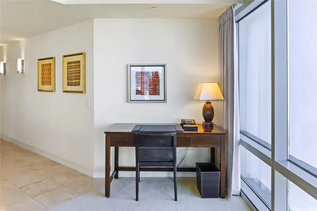 a bedroom with a large bed and a large window