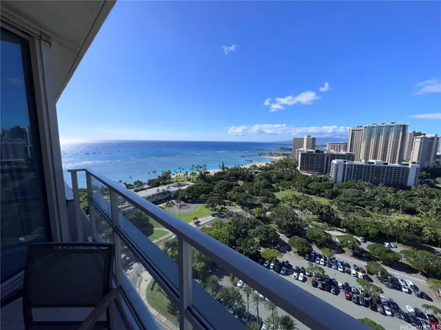 a view of a balcony with chairs and a table