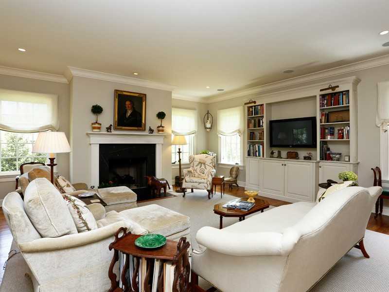 496 Valley Road Cos Cob, CT 06807 - Photo 3 of 14 a living room with furniture a flat screen tv and a fireplace
