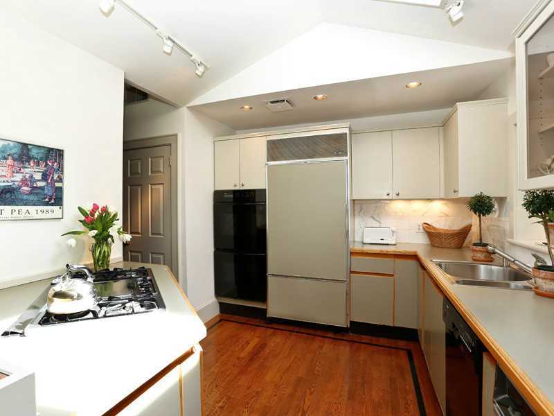 496 Valley Road Cos Cob, CT 06807 - Photo 7 of 14 a kitchen with a refrigerator and a stove top oven