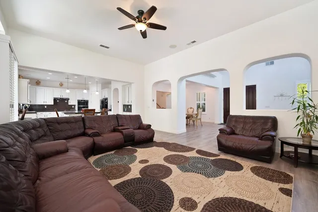 a living room with furniture and a rug