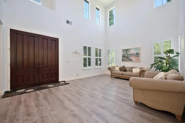 a living room with furniture and windows
